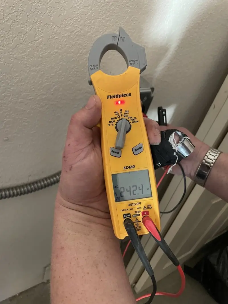 Voltage testing with clamp meter during Circuit Breaker Repair in Madison